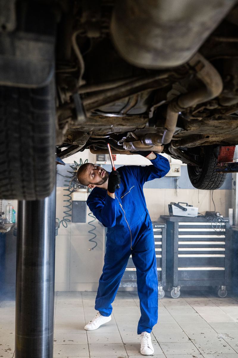 Mechanic inspecting chassis